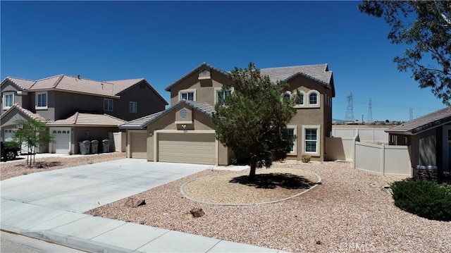 8846 Tamarisk Ave, Hesperia, CA 92344 - view of front of house featuring stucco siding, driveway, an attached garage, fence, and a tiled roof
