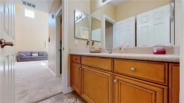 8846 Tamarisk Ave, Hesperia, CA 92344 - bathroom with vanity and baseboards
