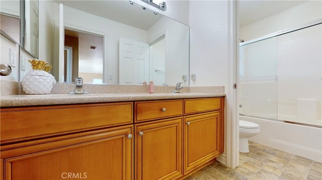 8846 Tamarisk Ave, Hesperia, CA 92344 - full bathroom featuring toilet, double vanity, and enclosed tub / shower combo