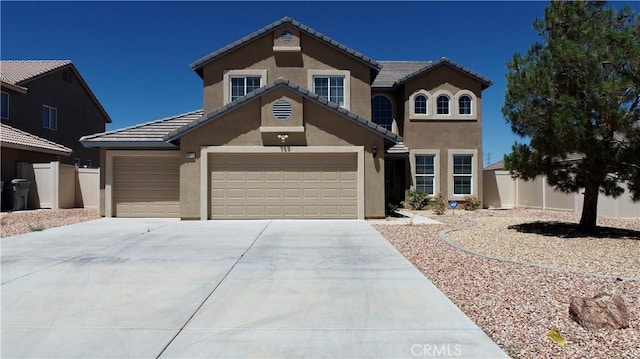 8846 Tamarisk Ave, Hesperia, CA 92344 - view of front of home with stucco siding, concrete driveway, an attached garage, and a tiled roof