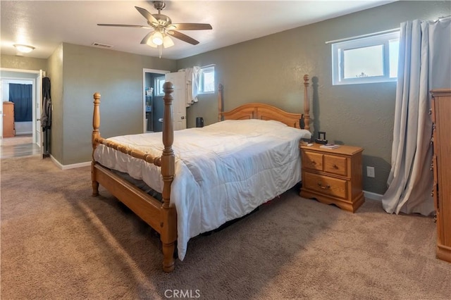 bedroom with light carpet, visible vents, a ceiling fan, and baseboards