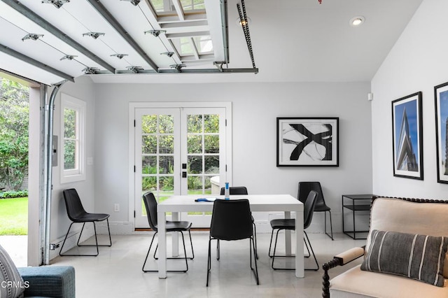 dining room with recessed lighting, french doors, baseboards, and concrete floors