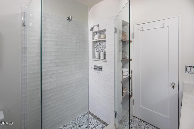 bathroom featuring a shower stall