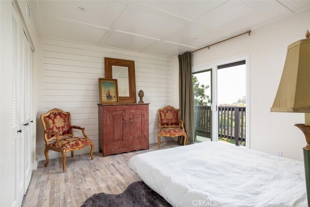 236 Avenida Montalvo, San Clemente, CA 92672 - bedroom featuring access to outside, light wood-style floors, and wooden walls