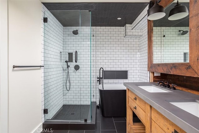 236 Avenida Montalvo, San Clemente, CA 92672 - bathroom featuring a shower stall, double vanity, tile patterned floors, and tile walls