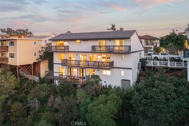 236 Avenida Montalvo, San Clemente, CA 92672 - back of house at dusk featuring a balcony