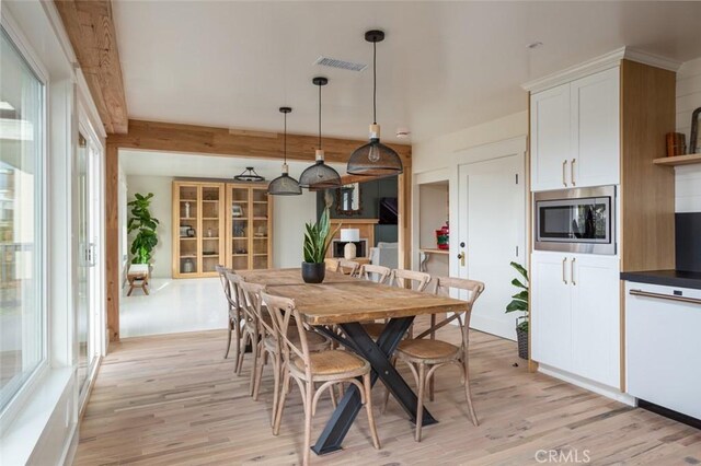 236 Avenida Montalvo, San Clemente, CA 92672 - dining space featuring light wood finished floors and beamed ceiling