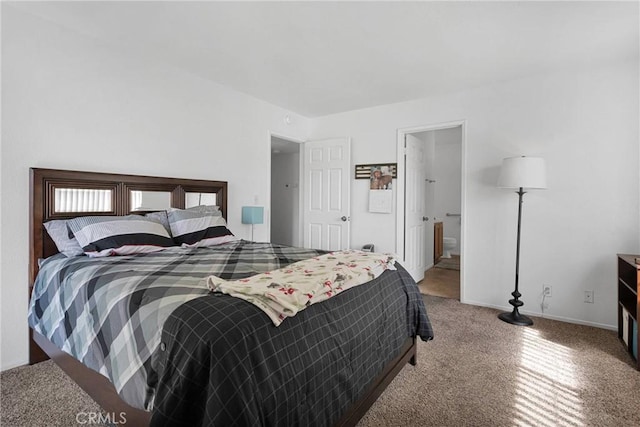 bedroom with carpet flooring and baseboards