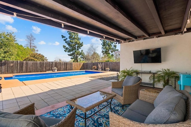 view of swimming pool with a patio area, a fenced in pool, and a fenced backyard