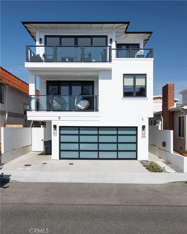 modern home featuring an attached garage and driveway