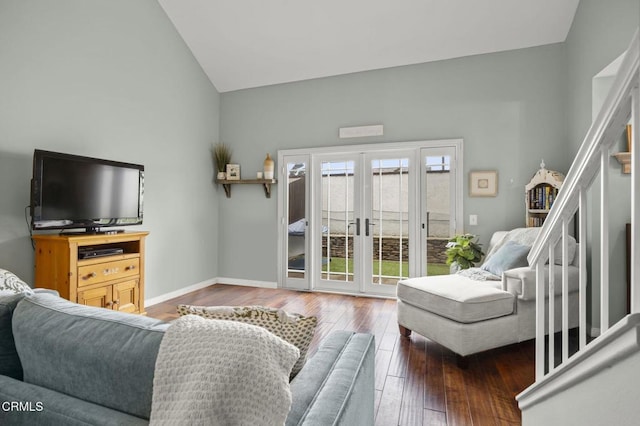 living area featuring french doors, wood-type flooring, baseboards, and vaulted ceiling