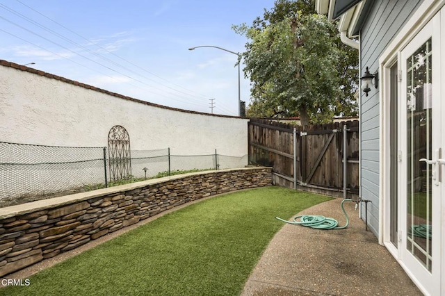 view of yard featuring a gate and fence