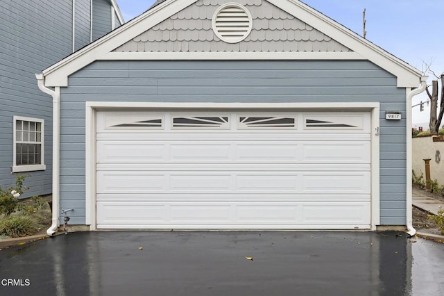 garage with aphalt driveway