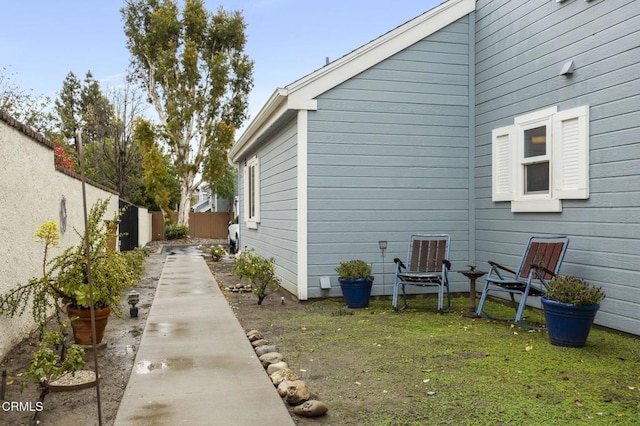 view of side of home featuring a fenced backyard