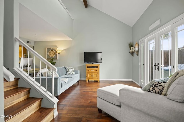 living room with stairs, hardwood / wood-style flooring, baseboards, and high vaulted ceiling