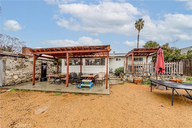 view of patio featuring fence and a pergola