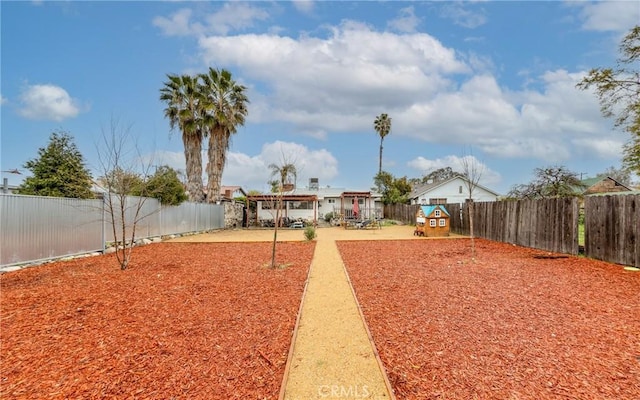 view of yard featuring a patio and a fenced backyard