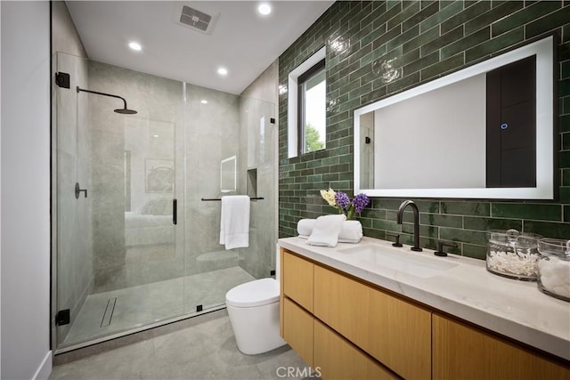 5244 Tampa Ave, Tarzana, CA 91356 - bathroom with vanity, a shower stall, toilet, and tile walls