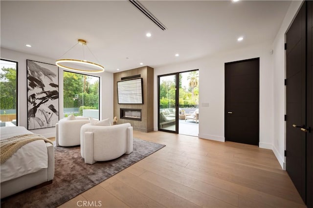 5244 Tampa Ave, Tarzana, CA 91356 - bedroom with recessed lighting, multiple windows, wood finished floors, and access to outside