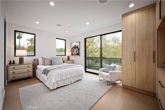 5244 Tampa Ave, Tarzana, CA 91356 - bedroom with access to exterior, light wood-style flooring, and recessed lighting