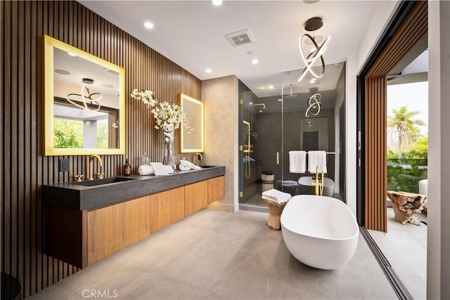 5244 Tampa Ave, Tarzana, CA 91356 - bathroom with visible vents, a soaking tub, double vanity, a stall shower, and a sink