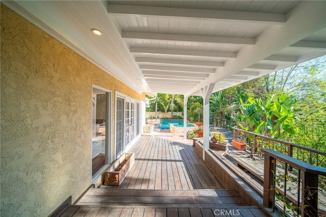 deck featuring an outdoor pool