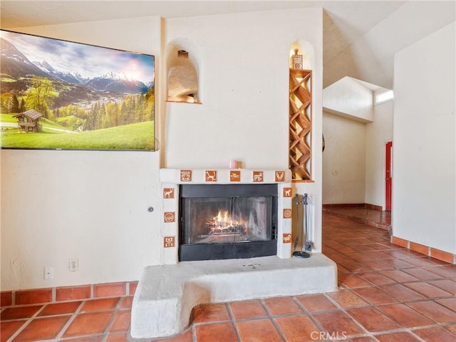 room details featuring a lit fireplace