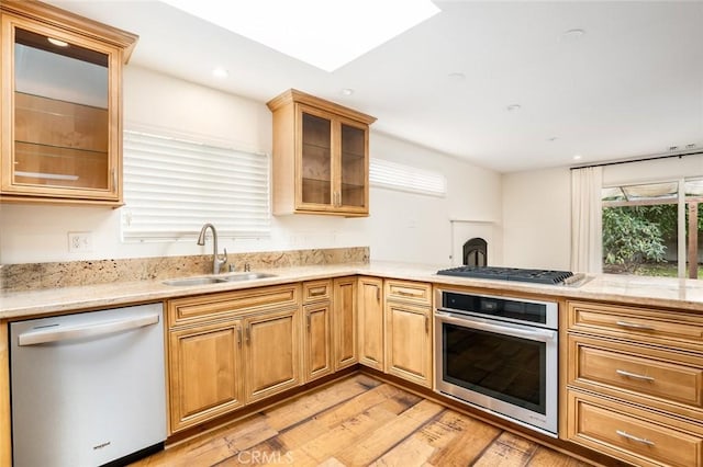 6432 Weber Cir, Huntington Beach, CA 92647 - kitchen with a sink, recessed lighting, light wood-style flooring, glass insert cabinets, and appliances with stainless steel finishes
