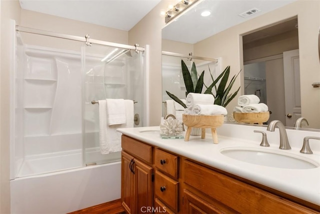 bathroom featuring a sink, visible vents, and double vanity