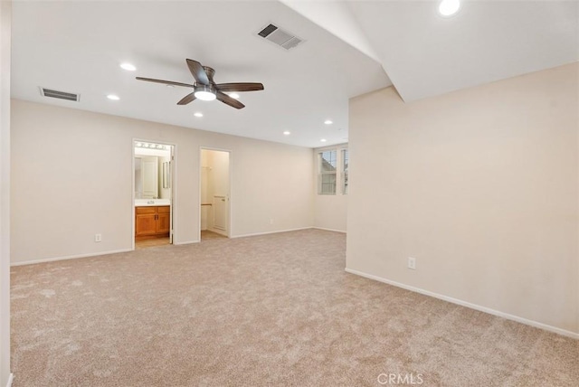 spare room with recessed lighting, visible vents, light carpet, and a ceiling fan