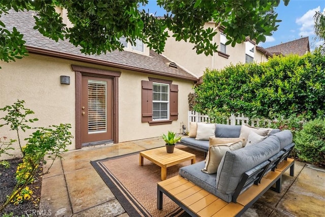 view of patio with outdoor lounge area and fence