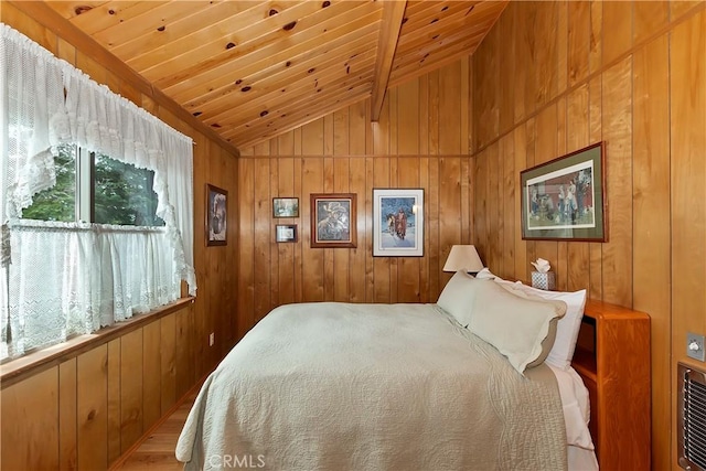 bedroom featuring lofted ceiling, wood finished floors, wood ceiling, and wood walls