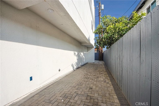 view of patio / terrace featuring fence