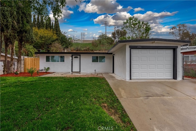 ranch-style home featuring stucco siding, concrete driveway, a front yard, and fence