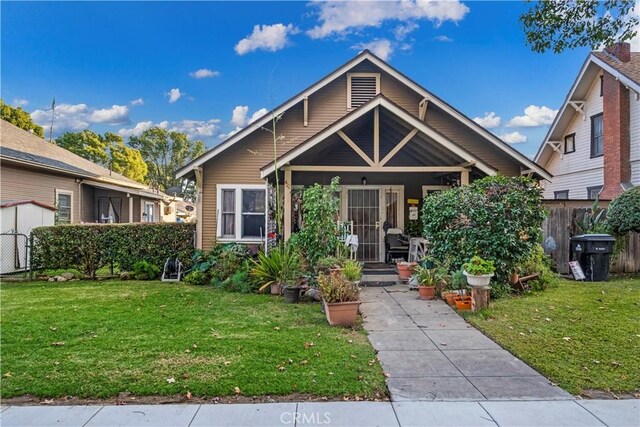 428 E E St, Ontario, CA 91764 - view of front of house featuring a front yard and fence