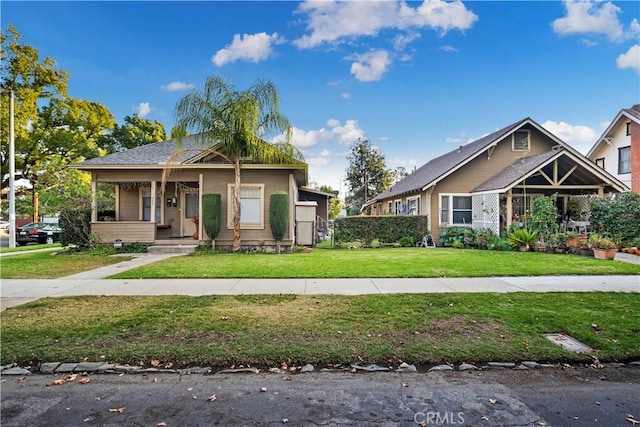 428 E E St, Ontario, CA 91764 - view of front facade featuring a porch and a front yard
