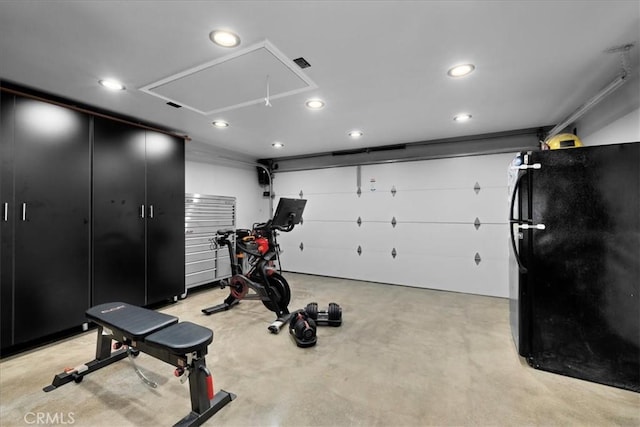 exercise area with recessed lighting and attic access