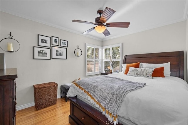 bedroom with ceiling fan, baseboards, light wood finished floors, and ornamental molding