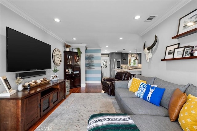 living area with recessed lighting, dark wood-style floors, visible vents, and ornamental molding