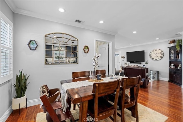 dining area with recessed lighting, visible vents, wood finished floors, and crown molding