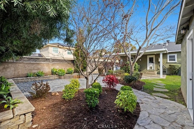 view of yard with a patio and fence