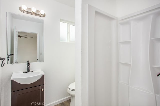 full bathroom featuring toilet, wood finished floors, and vanity