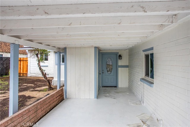 view of patio featuring fence