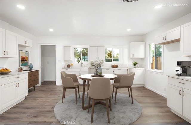 dining space featuring recessed lighting, light wood-style flooring, baseboards, and visible vents