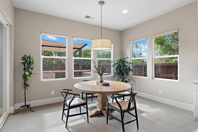 dining space featuring a wealth of natural light, visible vents, baseboards, and recessed lighting