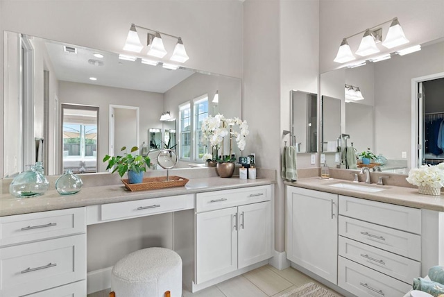 full bathroom with vanity and tile patterned flooring