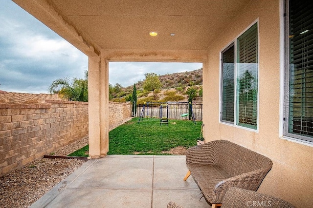 view of patio with a playground