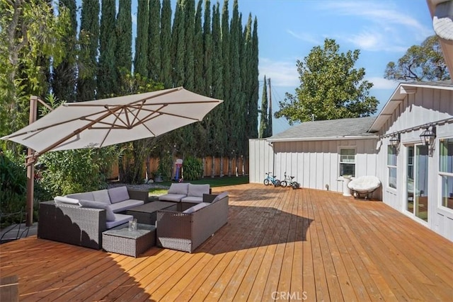 deck featuring fence and an outdoor hangout area