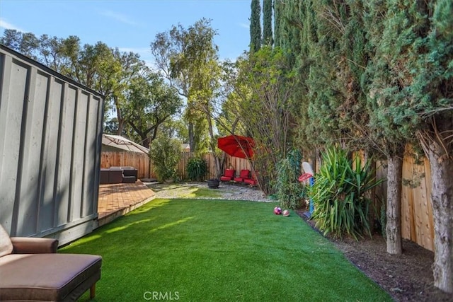 view of yard featuring a patio and a fenced backyard