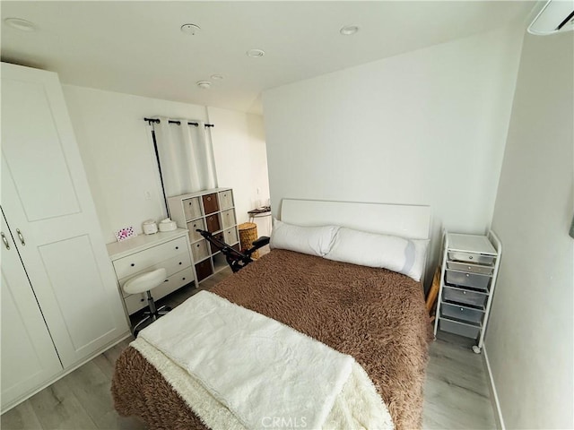 bedroom featuring wood finished floors